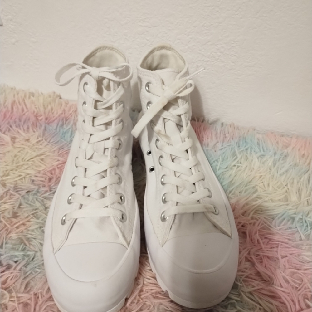 White high Platform Converse sneakers are 2 inches. Tall . Size 8.5 Women.